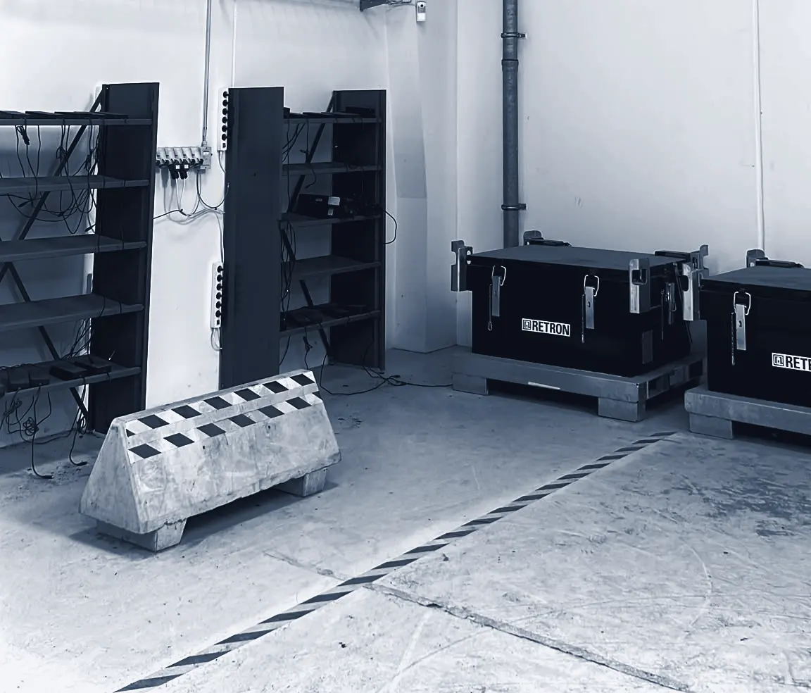Battery charging racks and certified transport crates in the operations hub
