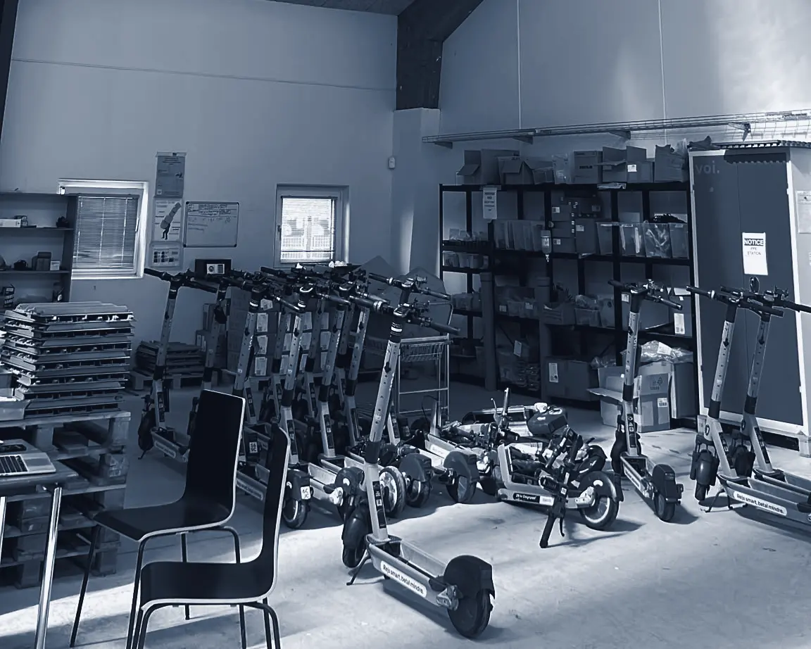 Shared e-scooter fleet staged for maintenance in the workshop
